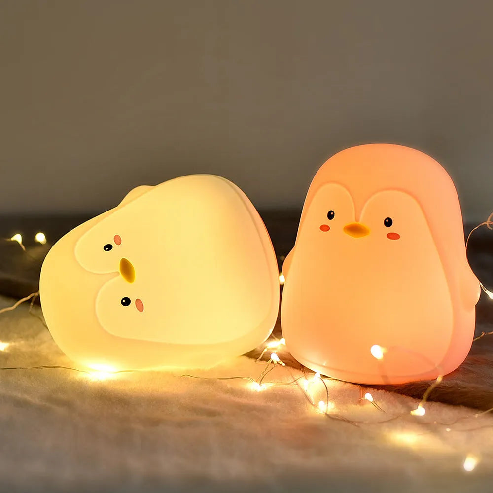 Penguin-shaped USB rechargeable night light with white LED illumination, measuring 118x110x132mm