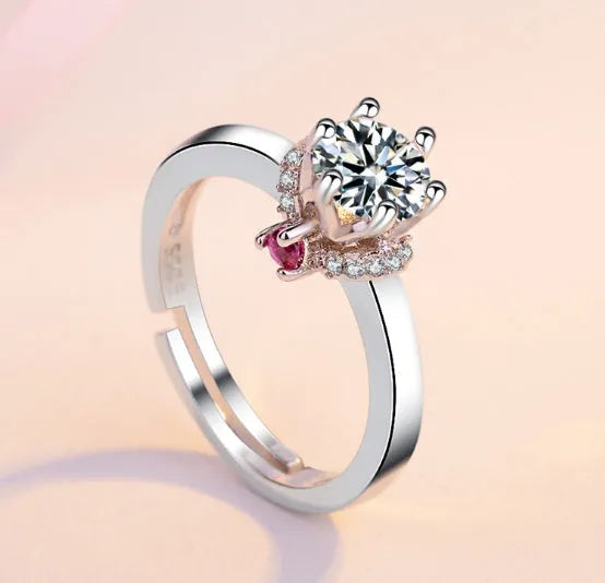 Classic six claw simulated diamond engagement ring plated in 18k white gold with round cut centre stone.