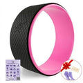 Yoga wheel in green with TPE surface and ABS core on a mat
