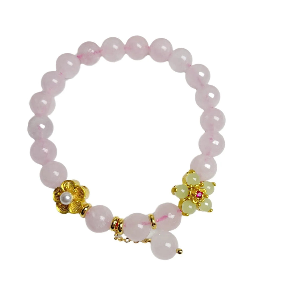 Pink crystal peach blossom bracelet with adjustable sliding knot closure on wrist
