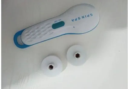 Electric facial cleanser in white and blue with mild brush surface, 14x6x21cm, for deep cleaning and gentle exfoliation