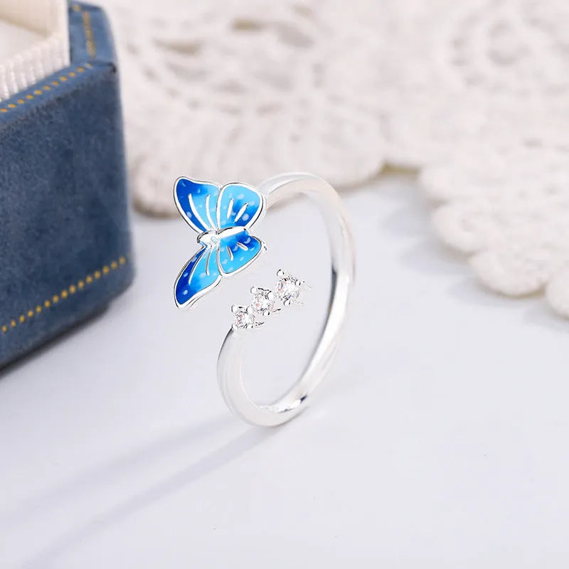 Copper butterfly ring with blue epoxy inlay, adjustable opening, silver colour, simple animal style