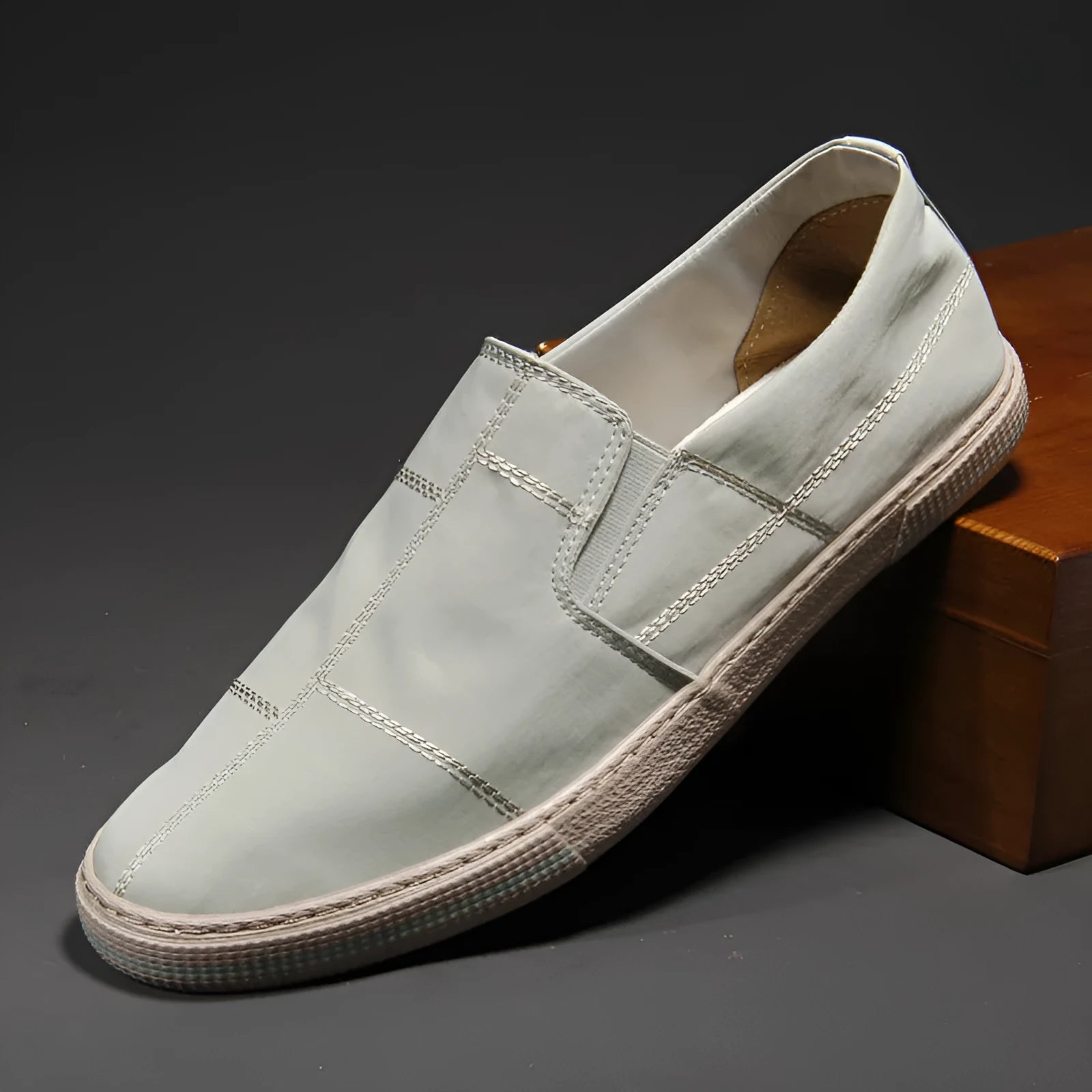Men's low-top slip-on canvas shoes in khaki colour with a round toe and vulcanised rubber sole.