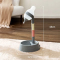 Green adjustable height pet water dispenser with detachable poles and non-drip drinking nozzle.