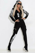 Black women's zip-up hooded tracksuit set with a printed pattern, shown as a two-piece outfit.