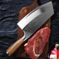 A stainless steel kitchen knife with a 320mm blade on a wooden cutting board.