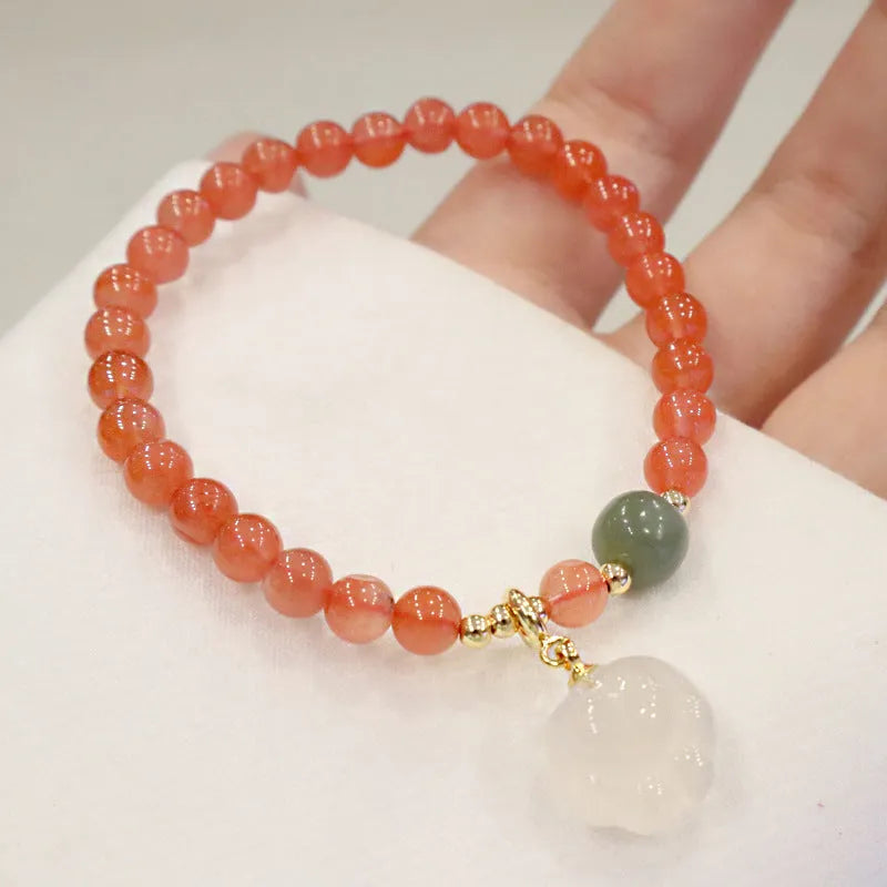 Natural red agate bracelet with zodiac animal and cat paw charms, gem inlays, 8mm bead size