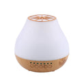 Wood grain finish USB essential oil aroma diffuser with optional Bluetooth control on a table