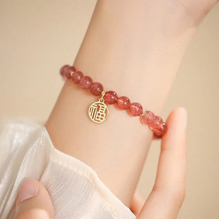 Handmade strawberry quartz blessing card bracelet with glass construction and adjustable universal wrist size
