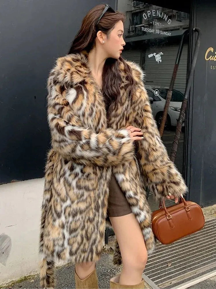 A woman's long faux fur coat with a fur collar in a street fashion style.