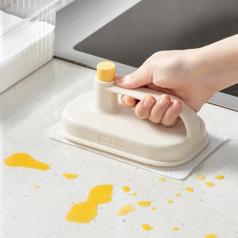 Magic Brush cleaning tool with plastic handle and stack of 50 white disposable non-woven fabric rags
