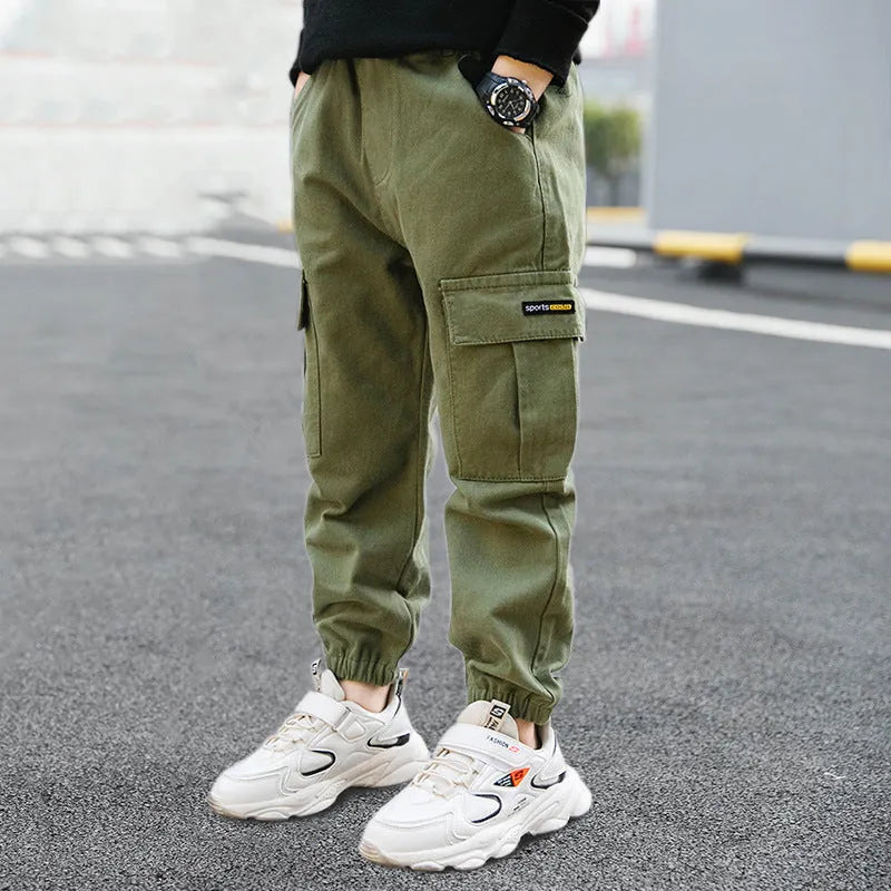 Boys' army green cotton casual trousers with long length, shown on a size chart