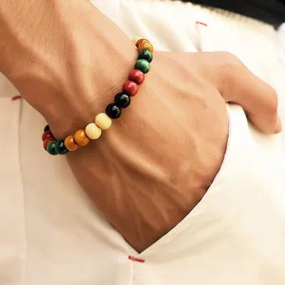 Natural stone beaded bracelet with lava stones for essential oils on a wrist.