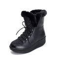 Women's black lace-up winter boots with a platform sole on a white background
