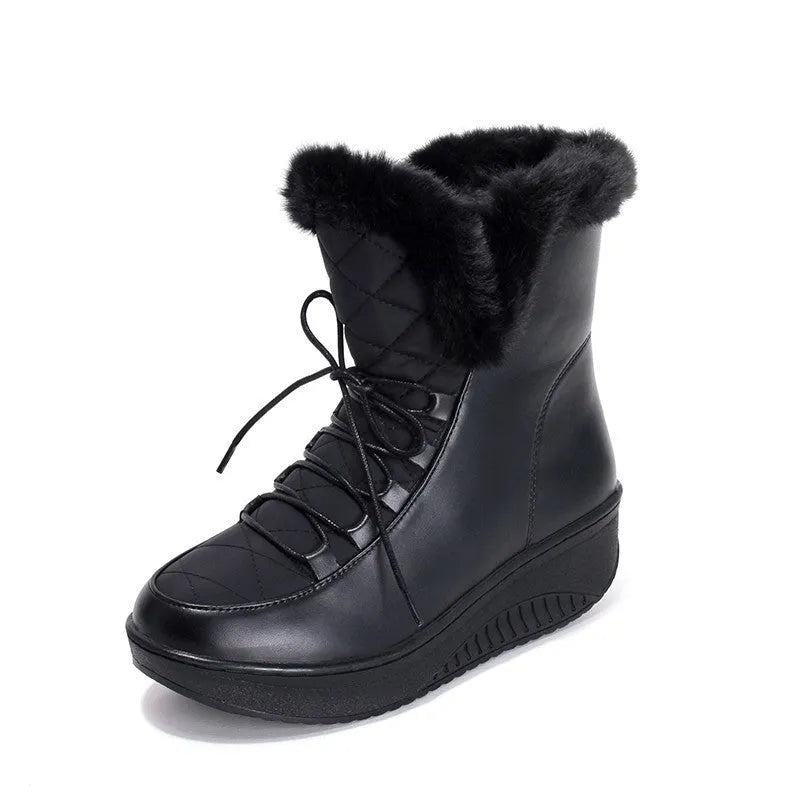 Women's black lace-up winter boots with a platform sole on a white background