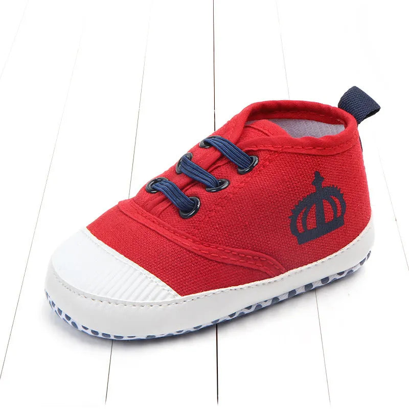 Red and white cotton canvas toddler shoes with elastic band closure in three size options