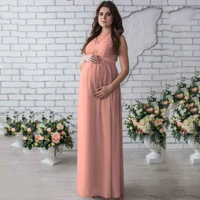 White lace sleeveless maternity dress with polyester fabric on dress form