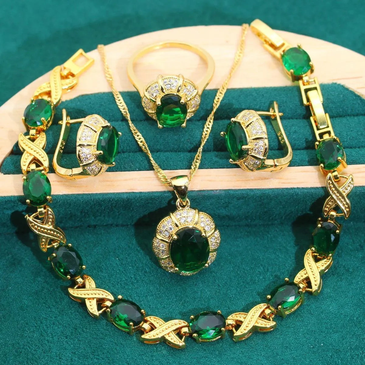 Gold plated jewellery set with colourful cubic zirconia stones, showing necklace, earrings, ring, and bracelet.