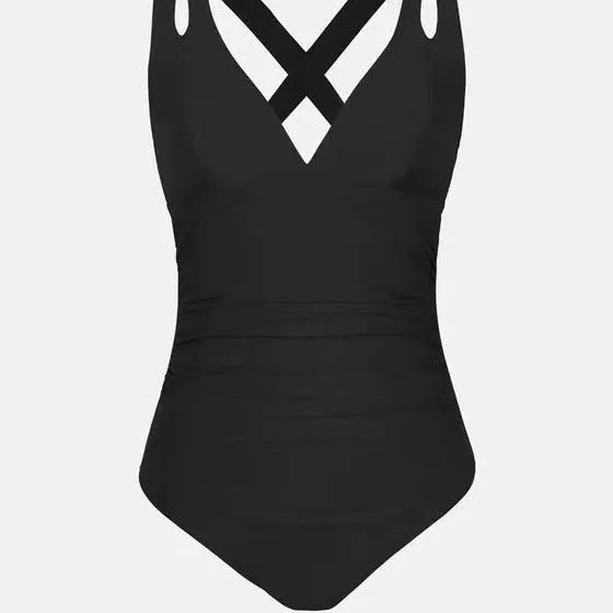 Solid colour one-piece bikini swimsuit with cross shoulder straps on a mannequin, showing front view.