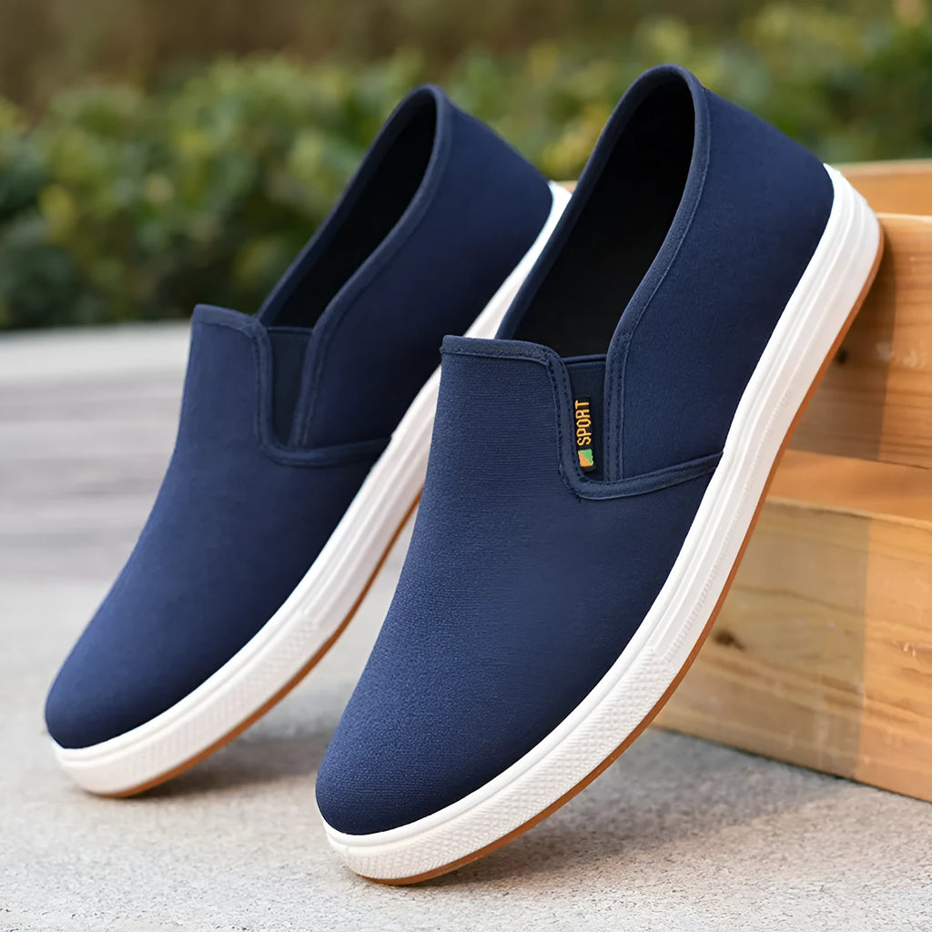 Men's black and blue slip-on canvas cloth shoes with round toe and injection moulded sole