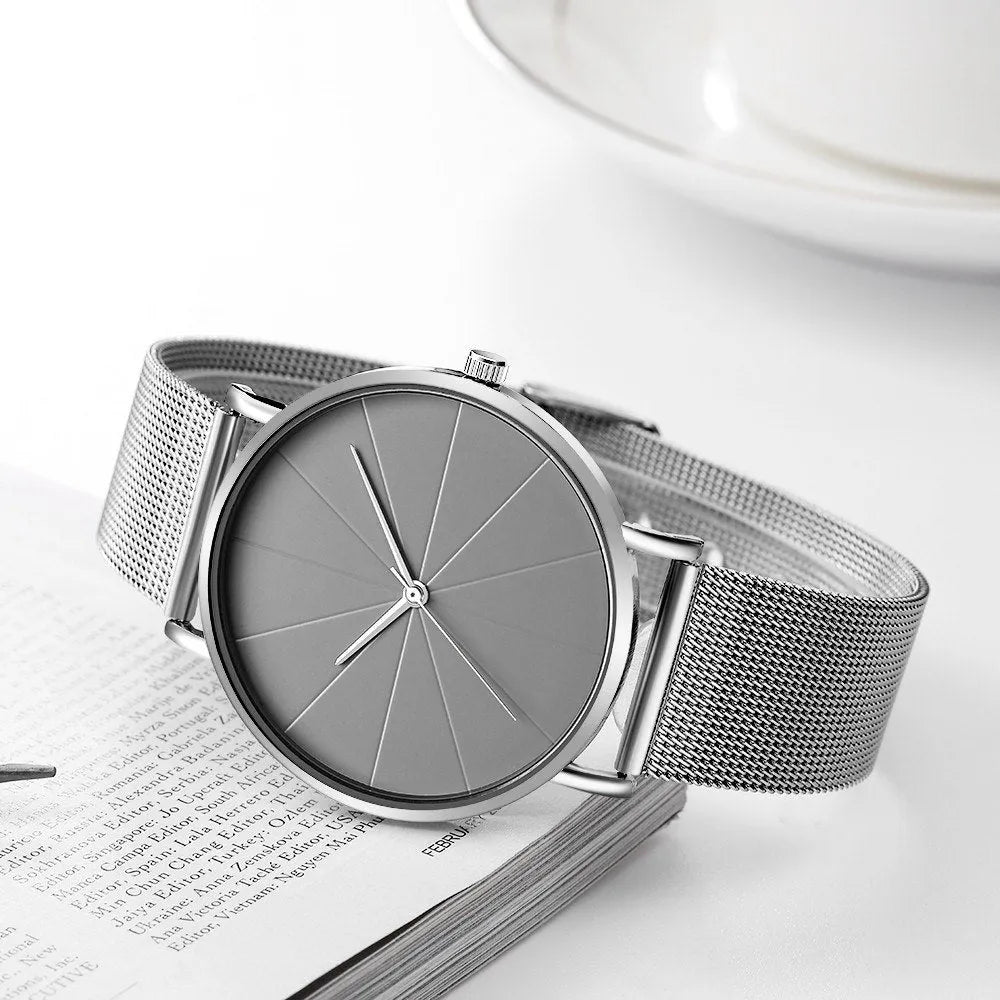 Stainless steel men's quartz watch with round dial, date window, and adjustable pin buckle on a white background.