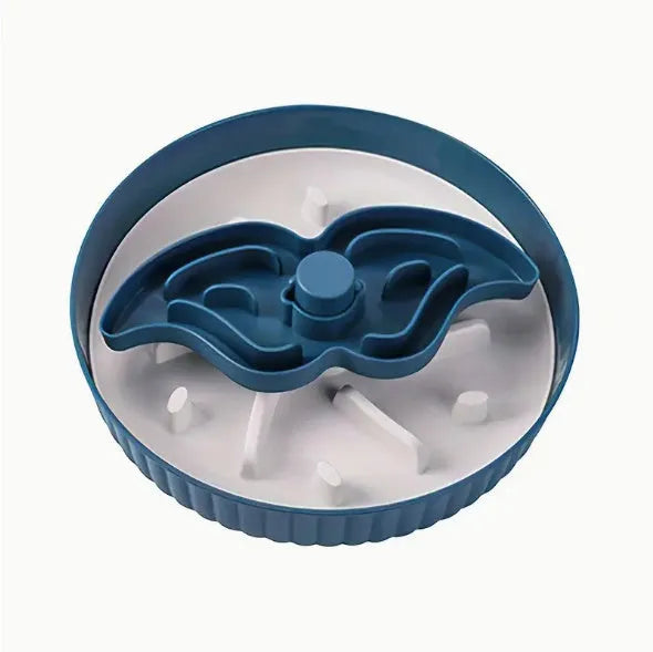 Grey pet slow feeder bowl with rotating windmill-pattern top and a white anti-choke silicone pad in the centre.