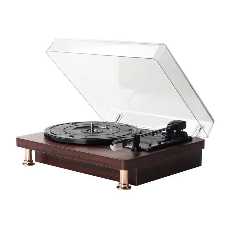 Retro vinyl record player with wood grain finish, transparent dust cover, and built-in speaker
