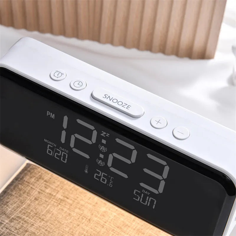 White 3-in-1 bedside lamp with wireless charging pad, LCD alarm clock display, and touch controls.