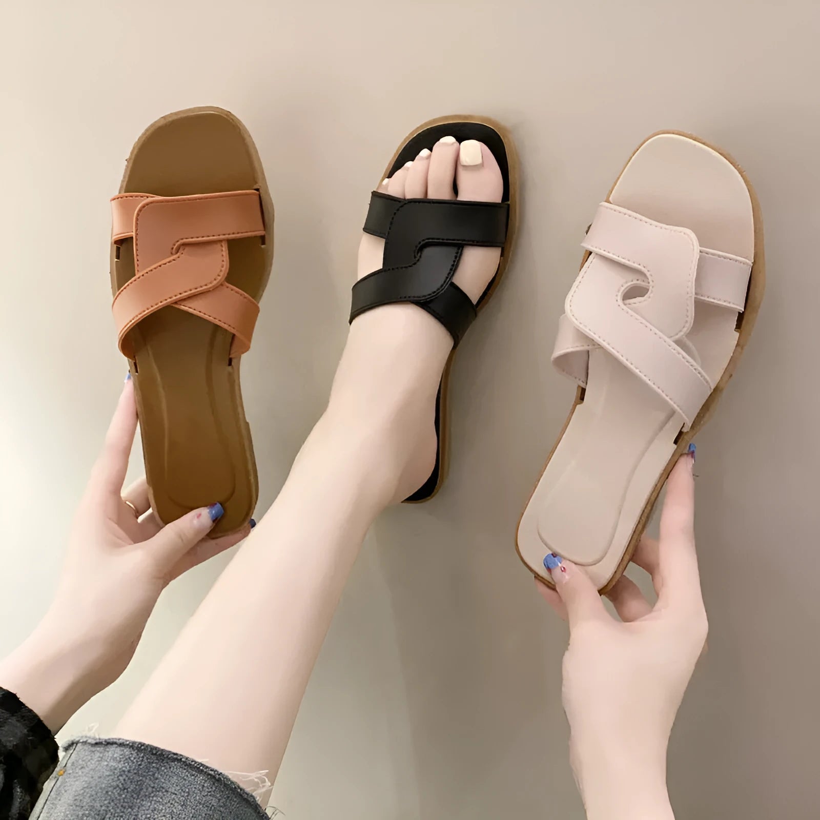 Women's white PVC cross strap toe ring sandals on a plain background