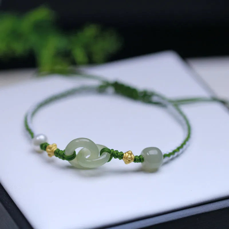 DIY woven bracelet with Hetian jade beads and silver or gold plated metal accents on a flexible wire band.