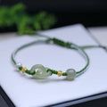 DIY woven bracelet with Hetian jade beads and silver or gold plated metal accents on a flexible wire band.