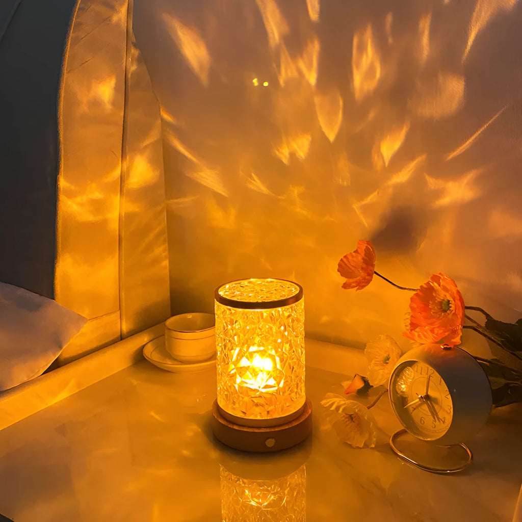 Rotating water ripple effect night light with acrylic dome on a solid wood base.