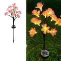 LED solar simulation camellia lawn lamp in garden setting, available in pink or yellow, IP65 rated, 720mm tall