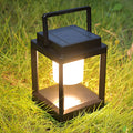 Outdoor USB handheld multifunctional charging ambient light lantern with black cover and white shell