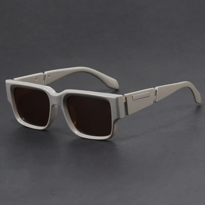 Square sunglasses with thick grey blue frames and UV-protective lenses