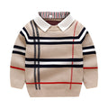 Boy wearing a navy blue plaid jacquard knit pullover sweater