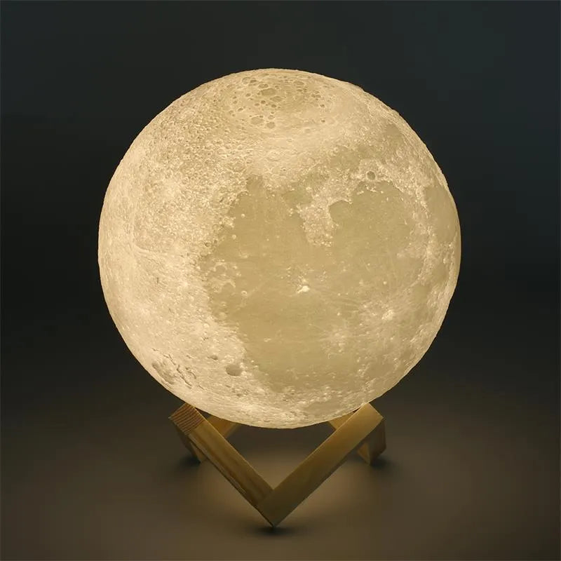 3D printed white moon lamp with detailed craters on a wooden holder, showing touch ring at base.