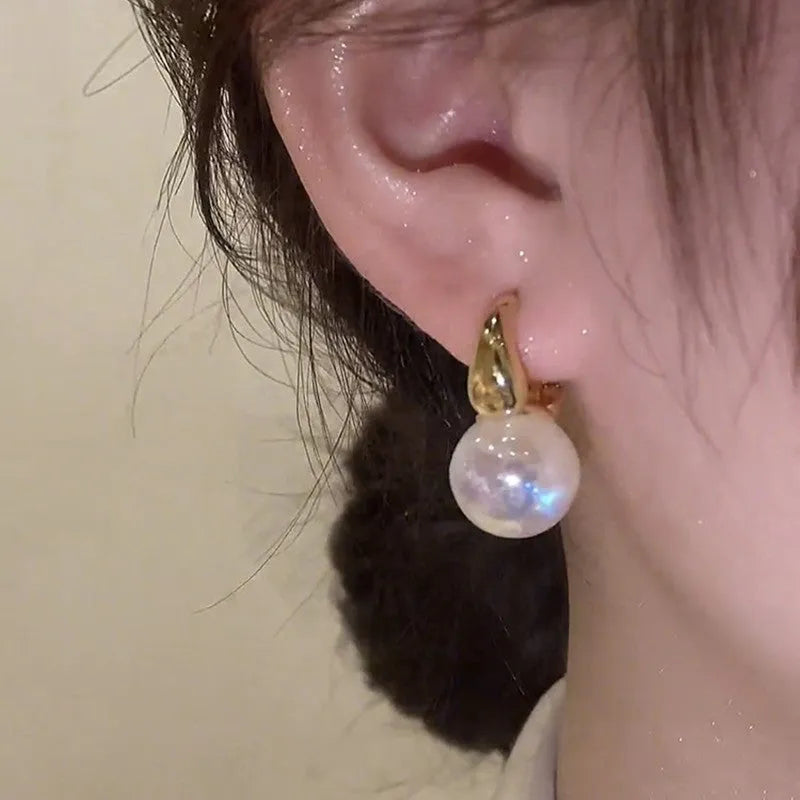 Mermaid pearl earrings for women with 14K gold finish and white pearl element