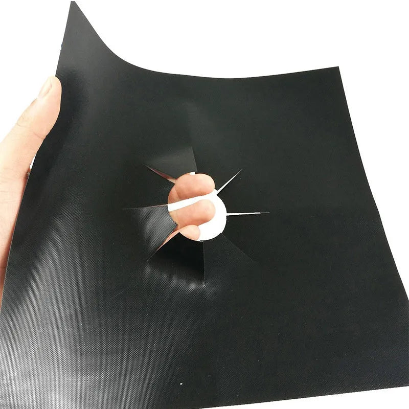 Gas stove surface protection pad made of Teflon-coated glass fibre cloth in black, measuring 27 x 27cm