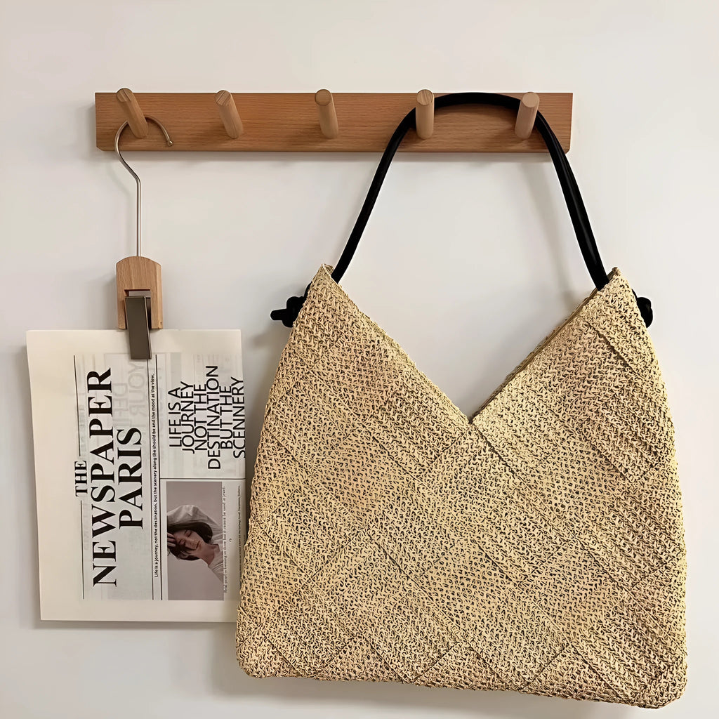 Women's beige straw hollow shoulder handbag in heart shape with woven texture and medium hardness