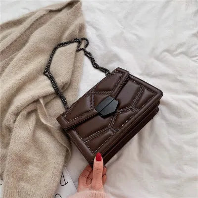 Small square shoulder bag with studs, chain handle, and zipper closure in wine red colour