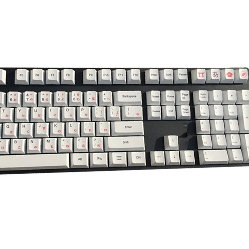 Set of PBT sublimation keycaps showing Japanese, Russian, and Korean language characters for mechanical keyboards.