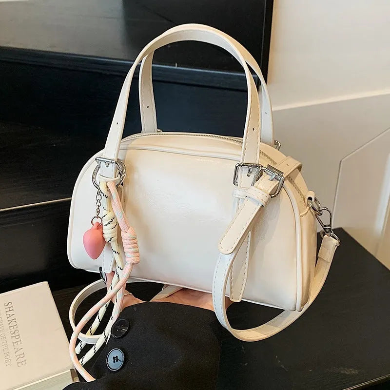 Korean style women's soft PU shoulder bag in shell shape with pendant options
