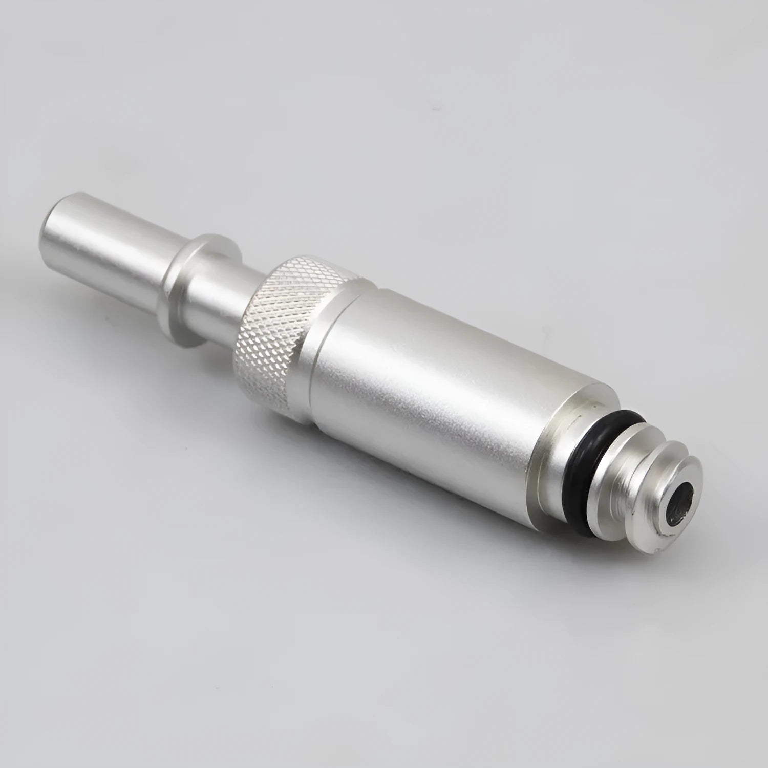 Silver metal VAS6262-9 transmission refueling joint tool on a workshop bench.