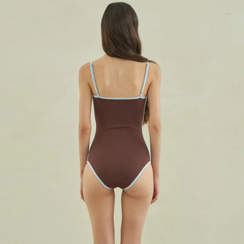 Brown triangle style one-piece swimsuit for women with sexy pattern