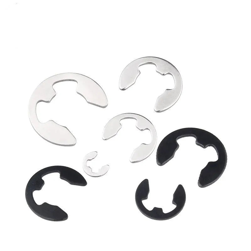 E-type snap spring M4 size in natural colour 304 stainless steel, shown isolated on white background