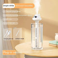 Small white plastic astronaut humidifier with USB cable on desk