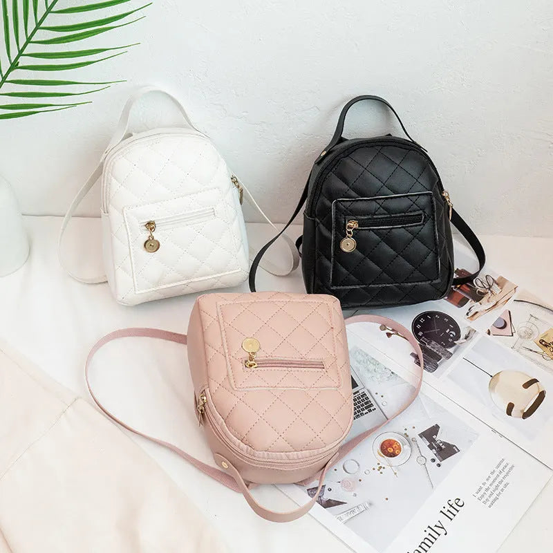 Hard square girls backpack with embroidered floral design in pink colour.