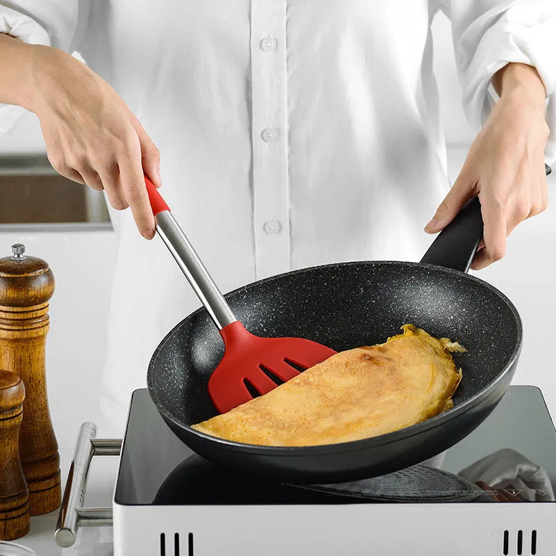 Seven-piece silicone kitchenware set includes spatula, colander, egg beater and other utensils with stainless steel tube handles in red colour