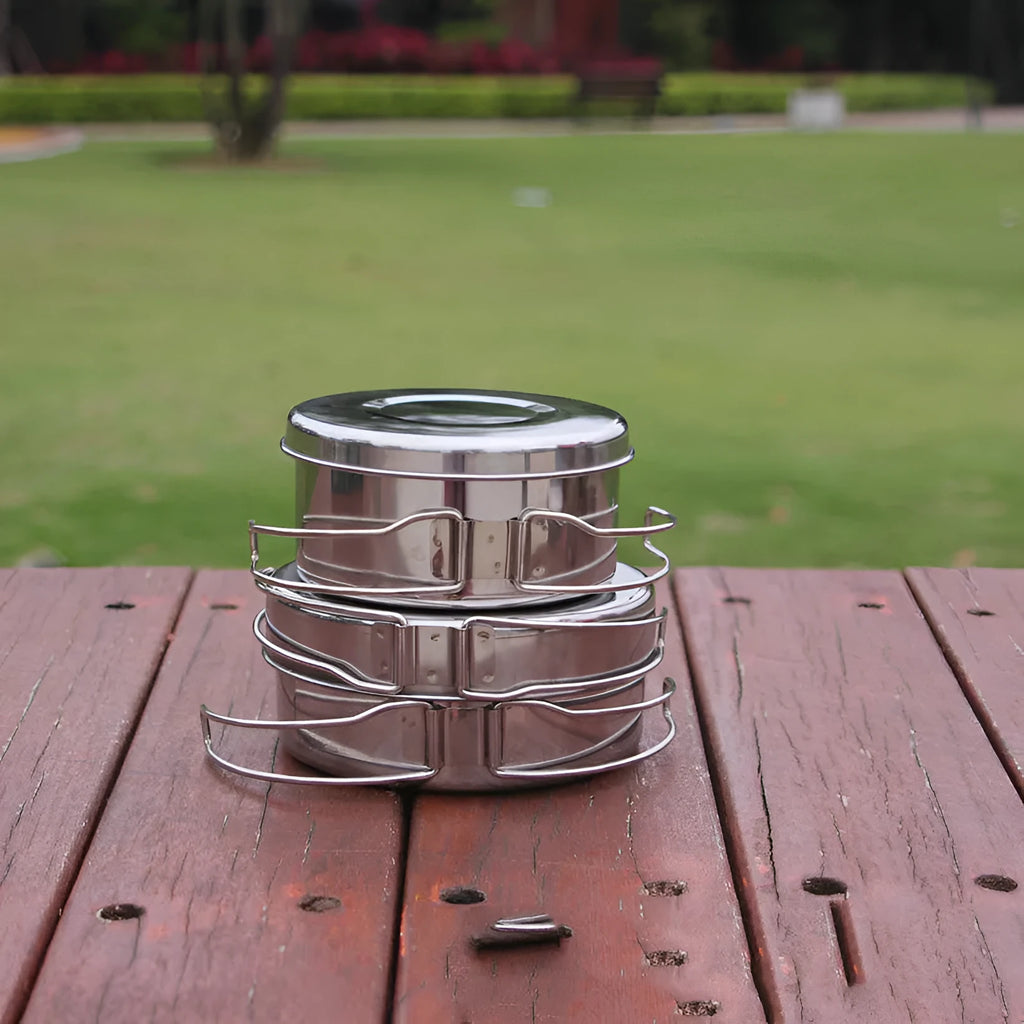 Silver stainless steel camping cookware set with 4 round pots for outdoor cooking